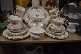 A part tea service, Moss Rose by Royal Albert, including cake plate, tea pot cups and saucers and