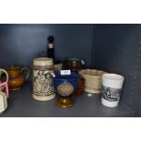 A selection of pub tavern ceramics including tankard and transfer printed beaker with fisherman