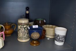 A selection of pub tavern ceramics including tankard and transfer printed beaker with fisherman