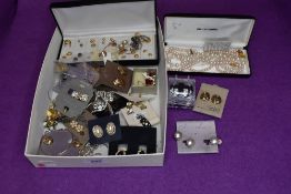 A tray of costume jewellery earrings including pierced and clip, and a Pierre Cardin simulated pearl