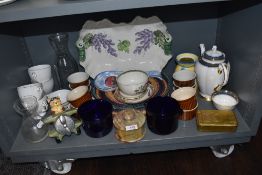 A varied lot containing reproduction Queen Mary Christmas tin, cups, dishes and more.
