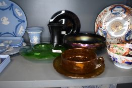 A collection of vintage glass including large crackle glass cup and saucer in amber, irridecent bowl