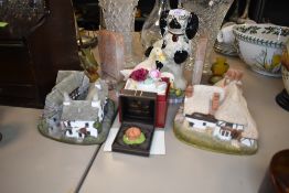 A selection of display items including Lilliput lane and Spaniel dog figure