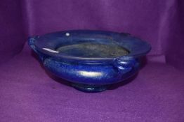 An antique art nouveau iridescent mottled blue bowl having triple handle and footed base 29cm across