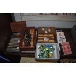 A selection of items including vintage marbles and cards games.