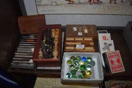 A selection of items including vintage marbles and cards games.