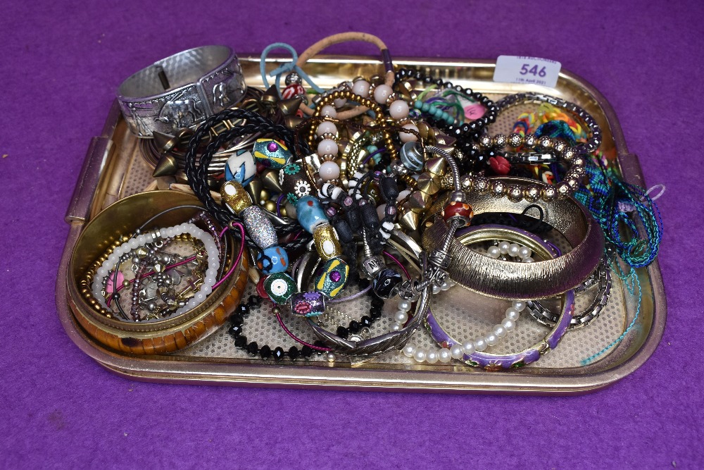 A selection of costume jewellery bangles and bracelets including leather, cord, Pandora style,