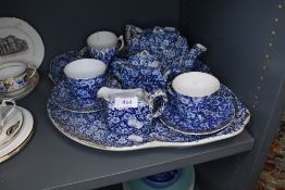 An antique chintz breakfast tray and tea set unmarked and un named most pieces having damage