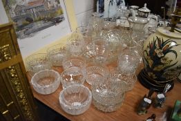 A mixed lot of vintage glass bowls, mugs, vases and more.