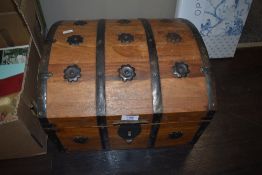 A wooden pirate style chest and selection of storage containers and cases