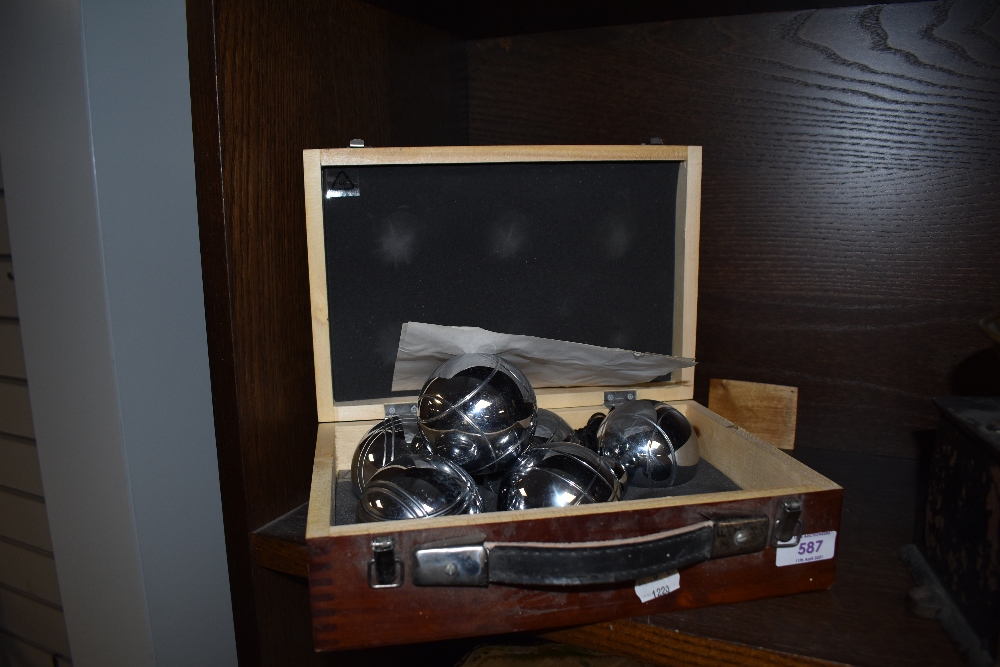 A wooden case of Boules.