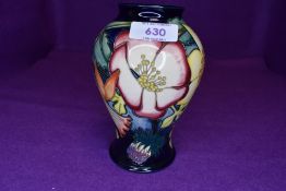 A Moorcroft golden jubilee vase of baluster form, circa 2001, having dog rose,daffodil and