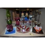 A selection of vintage and modern art glass including plates, bowls and vases.