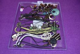 Thirteen costume jewellery necklaces of various styles including beaded, enamelled, chord etc
