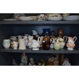 A collection of vintage and antique jugs, various styles and sizes.
