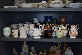 A collection of vintage and antique jugs, various styles and sizes.