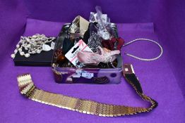 A selection of fashion items including hair slides, head bands, skull buckle, ring holder, bow ties,