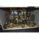 A large collection of vintage brass items including boxes, horse brasses candle sticks and more.