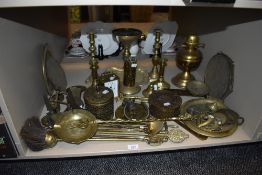 A large collection of vintage brass items including boxes, horse brasses candle sticks and more.