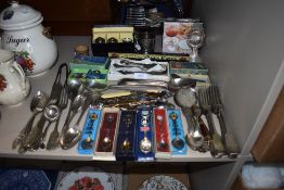 A good selection of serving wares including boxed flatware and cutlery including cruet set