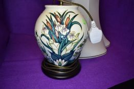 A Moorcroft lamp base 'Lamia' by Rachel Bishop, having Iris and Bullrush design on cream ground.