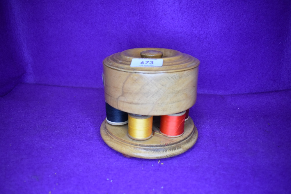 An interesting haberdashery cotton reel storage container made in oak