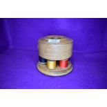 An interesting haberdashery cotton reel storage container made in oak