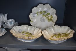 Three vintage French bowls with scalloped edges having hydrangea pattern.