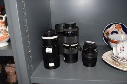 Three camera lenses; a Paragon 135mm, A Chinon zoom 85-210mm, A Soligor 200mm.