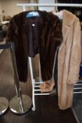 A light blonde vintage fur coat and a mahogany mink stole.