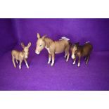 Three Beswick studies, Donkey 2267A, Donkey, second version 1364B and Donkey Foal 2110