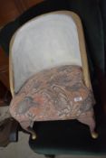 A vintage woven fibre style nursing chair