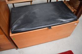 A vintage teak or similar bedding box having vinyl lid (hinged but not currently attached)