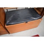 A vintage teak or similar bedding box having vinyl lid (hinged but not currently attached)
