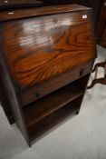 An early 20th Century oak bureau with bookcase under , width approx. 61cm