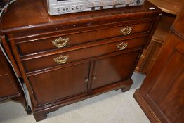 A vintage reproduction side cabinet in the Georgian style