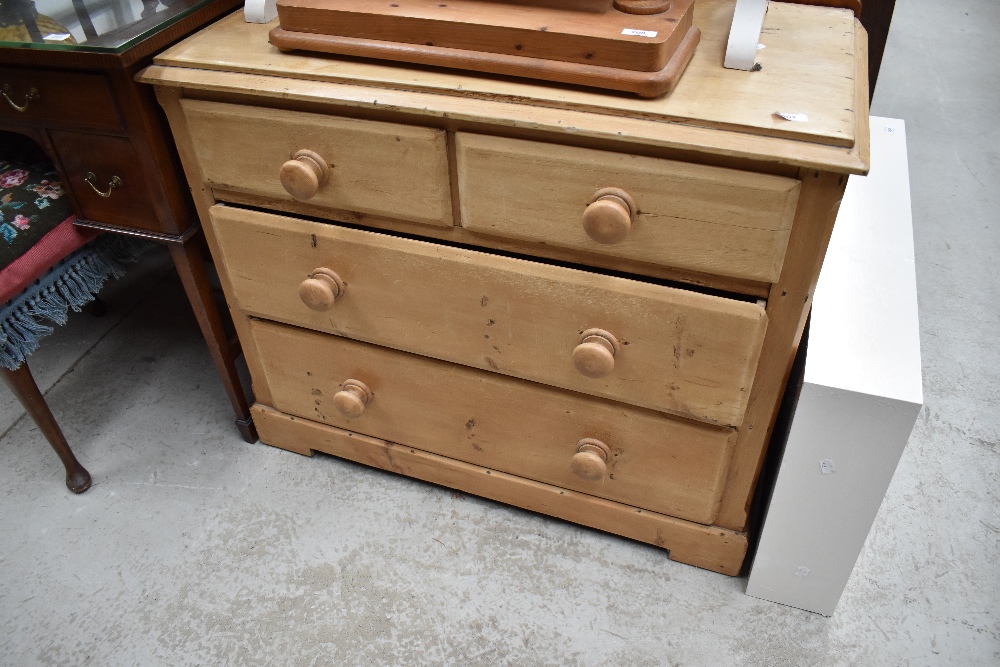 A stripped pine chest of two over two drawers, dimensions approx. W90 D45 H75cm