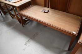 A vintage mid century teak coffee table