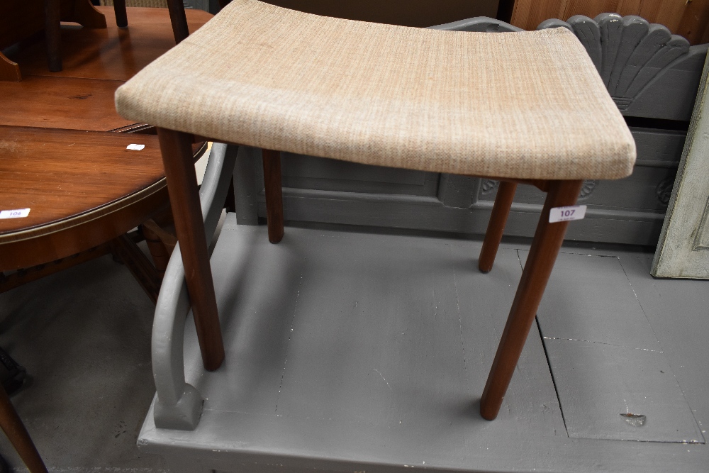 A 'Mid Century' teak dressing table stool, upholstery been removed