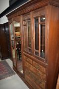 A late Victorian or Edwardian mahogany and walnut master robe of large proportions, comprising