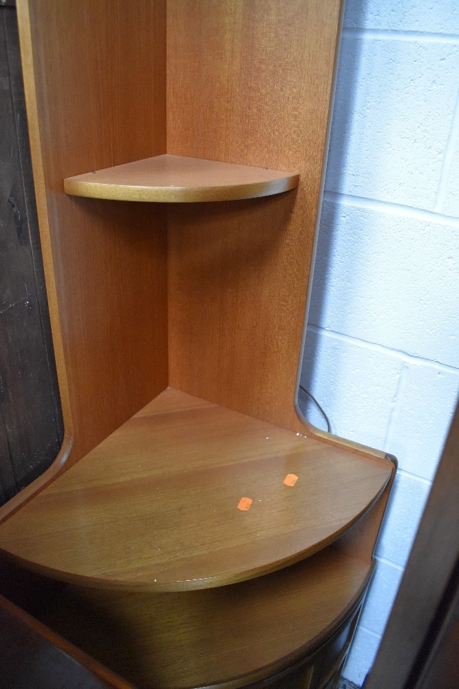 A vintage Nathan corner shelf with cupboard under