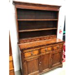 An 19th Century part oak and cross banded dresser , plate racking having three drawers to base, over