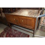 A late Victorian oak wash stand with marble top