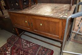 A late Victorian oak wash stand with marble top