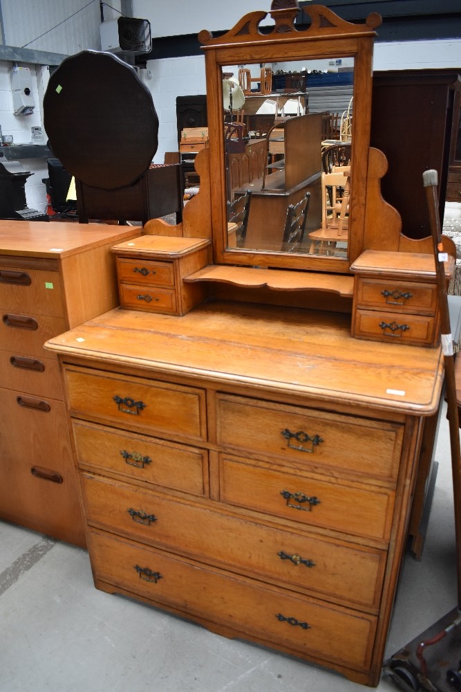 A late Victorian golden oak dressing table, width approx. 102cm, some damage to drawer handles but