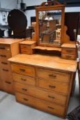 A late Victorian golden oak dressing table, width approx. 102cm, some damage to drawer handles but