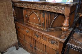 An Priory style oak court cupboard, width approx. 126cm