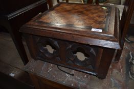 An Ecclesiastical style box stool having parquetry top, width approx. 42cm