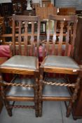 Four early 20th Century oak dining chairs having rail back and barley twist front stretcher (