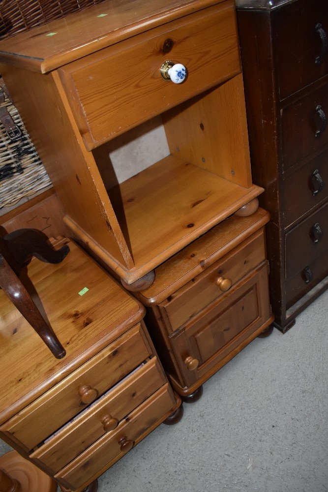 Three modern pine bedside chests/cabinets